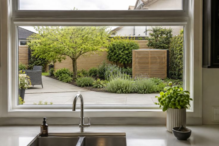 Kitchen Window Overlooking a Garden Patio